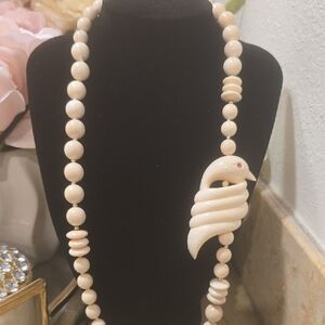 Elegant Cream Beaded Necklace with Bird Pendant